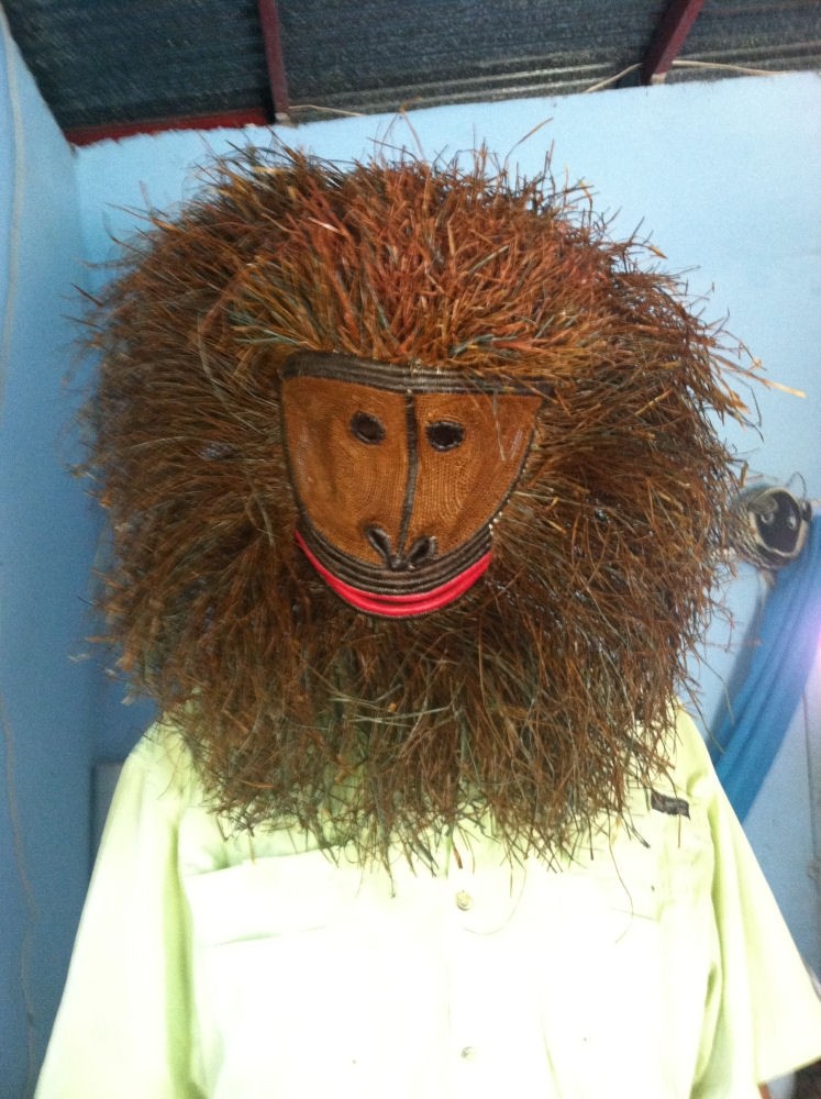 Here's a chiropractor with a sense of humor. He could scare the hurt out of you with his collection of native masks.