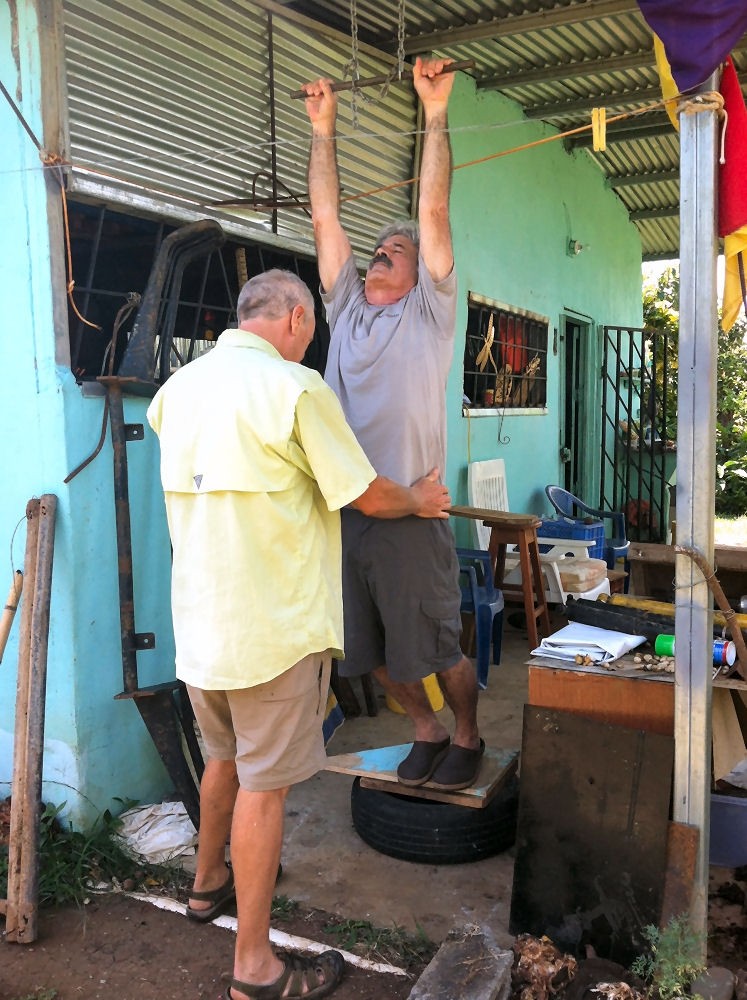 Dr. Ahrends uses gravity to help straighten out this suffering wayfarer.